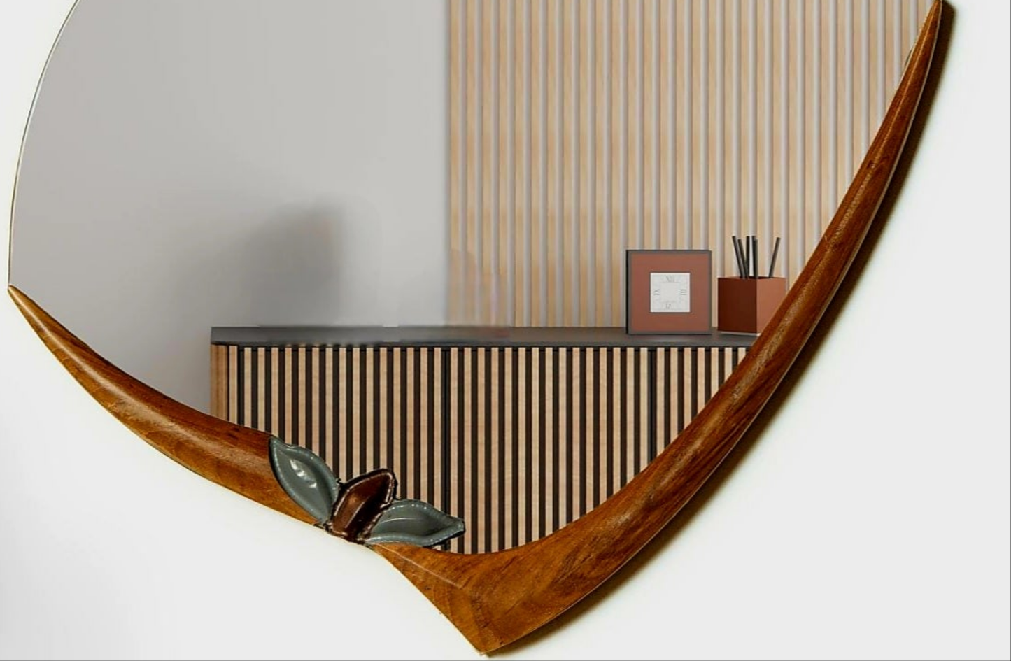 An oval-shaped mirror with a wooden frame in brown and gray tones, hanging on a wall above a lamp and a bench.