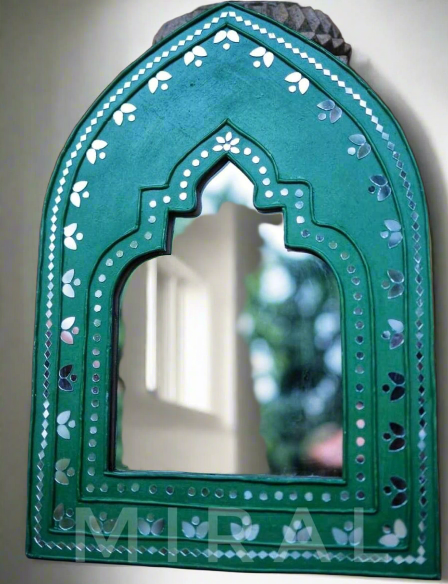 This product combines traditional Kutch Mural art with British geometric techniques and features a looking mirror at the center.