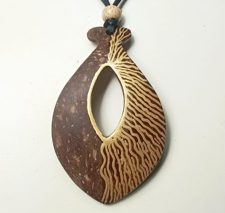 Wooden pendant with zebra pattern on a white background