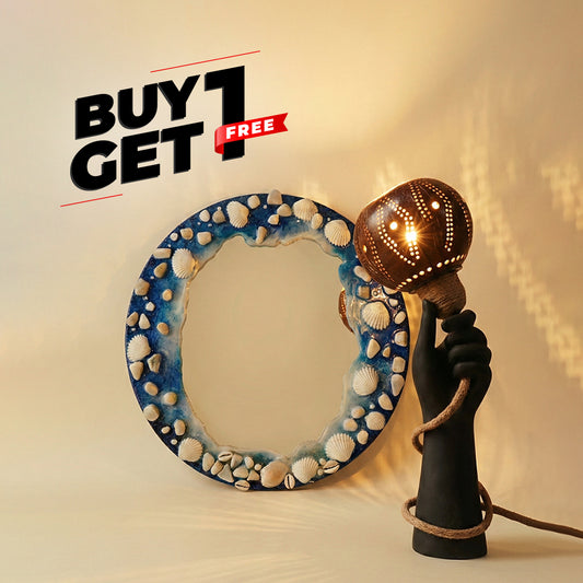 Decorative mirror with shell pattern and lamp shaped like a hand holding a light bulb on a beige background.