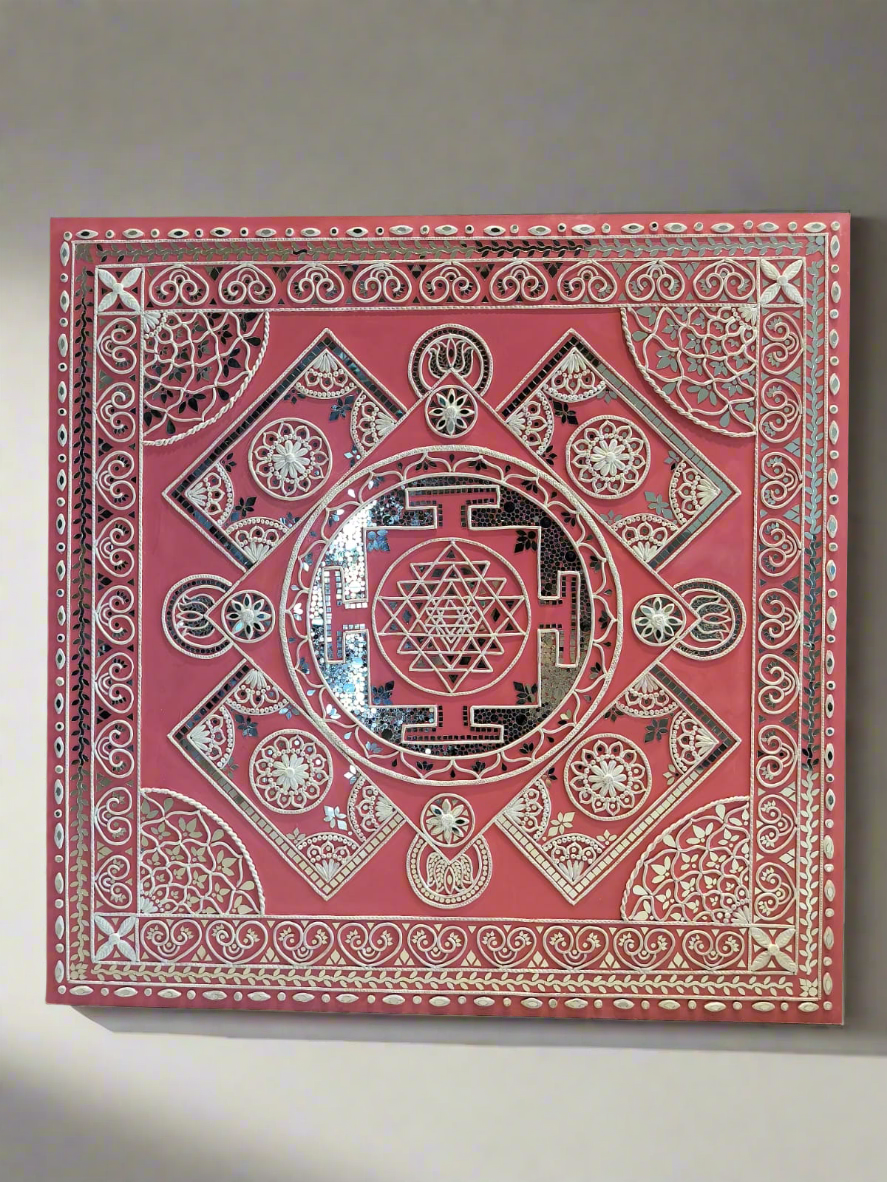 Decorative red book with intricate white patterns on a gray background