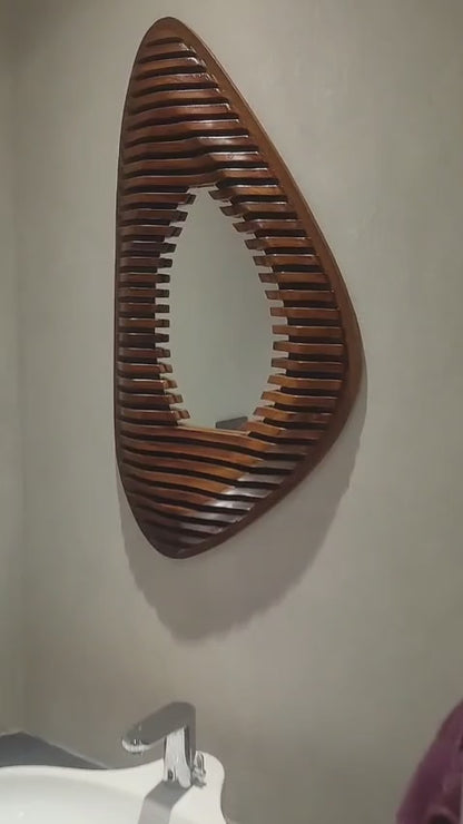 Wooden wall art with slatted design on a beige wall