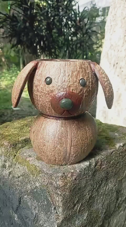 Wooden dog-shaped pen holder with pencils on a desk
