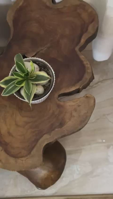 Wooden side table with natural design in a room setting