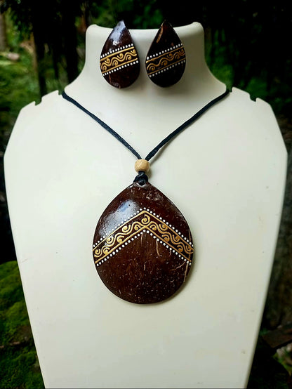 Coconut shell pendant and earrings on a white mannequin with a natural background