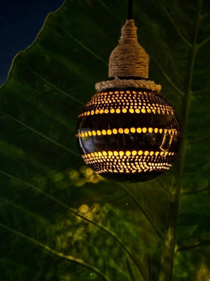 Decorative light bulb with wicker top on a leaf