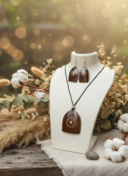 Jewelry set on a mannequin bust with a natural background of flowers and plants.