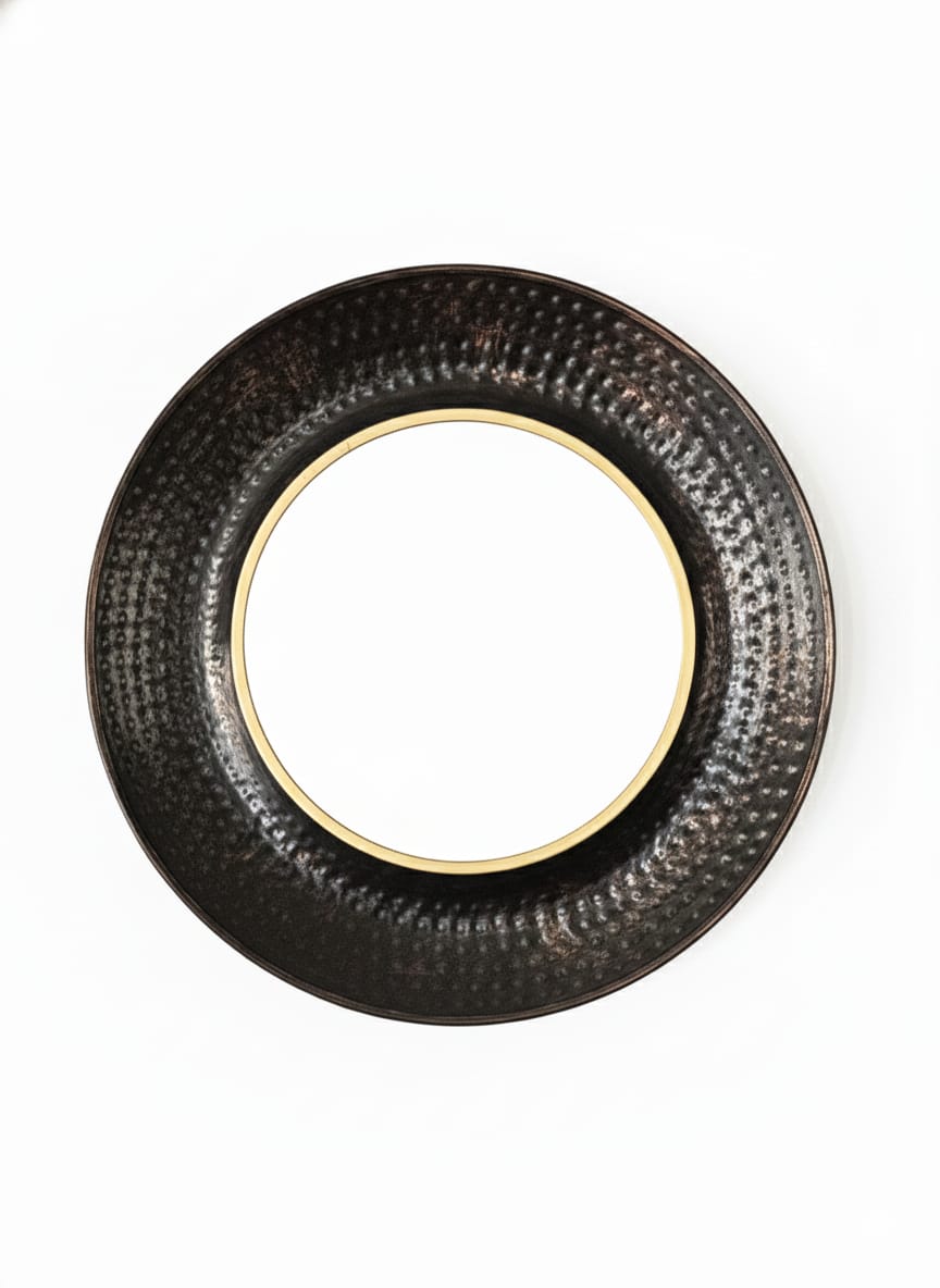 Round black textured object on a white background