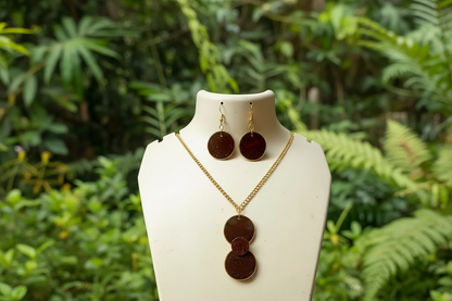 Jewelry set on a mannequin bust with a natural green background