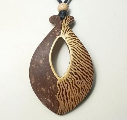 Wooden pendant with zebra pattern on a white background
