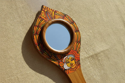 Decorative mirror with artistic design on a beige fabric background